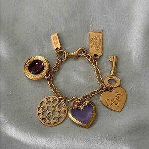 Coach Gold Bracelet with Purple Charms